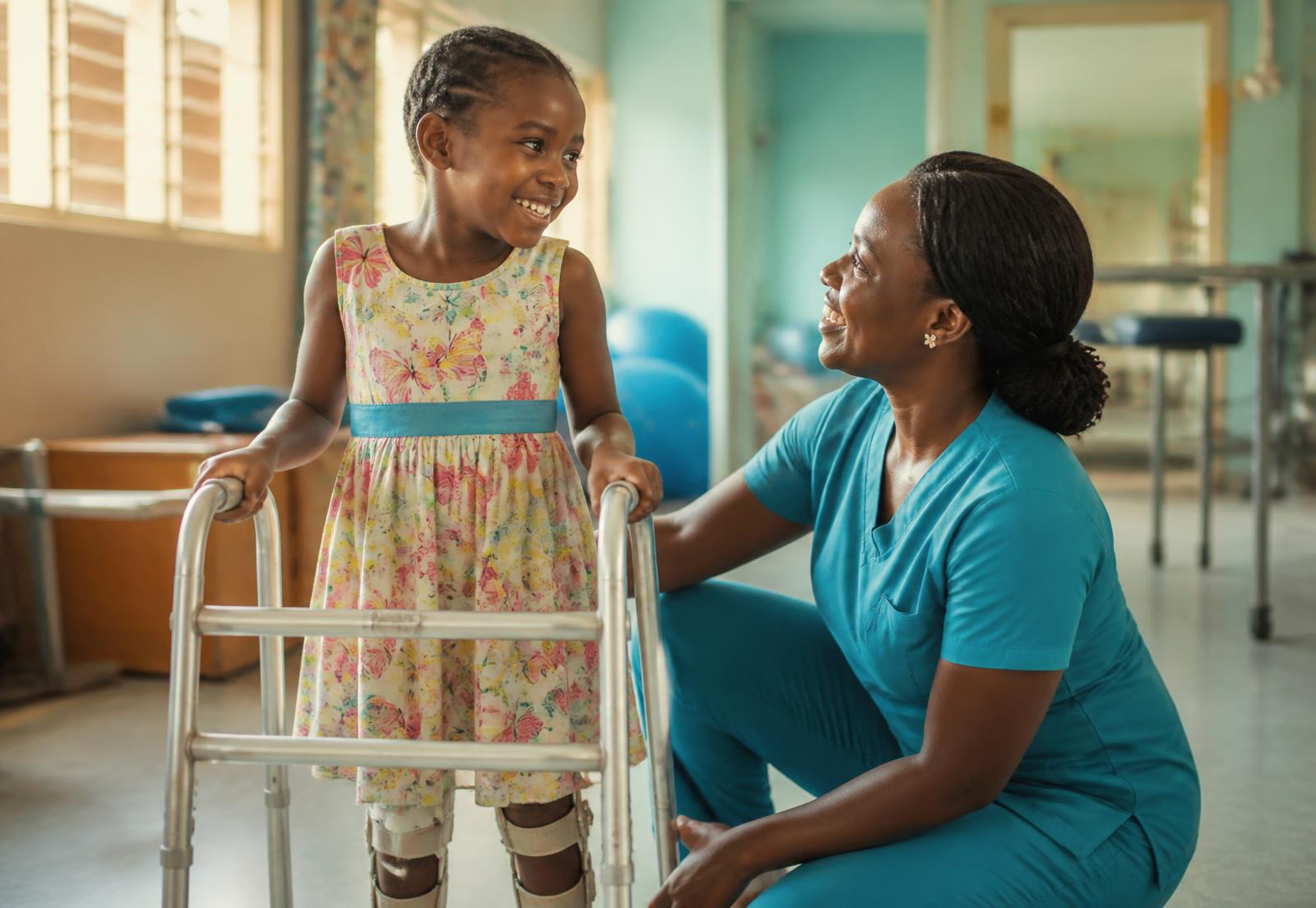 A physiotherapist guiding a child through a mobility exercise