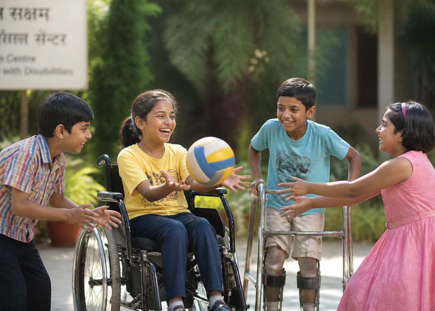 Children of mixed abilities playing together in an inclusive play session